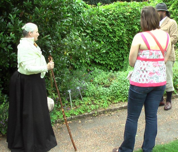 Caroline in Victorian costume on a plant walk