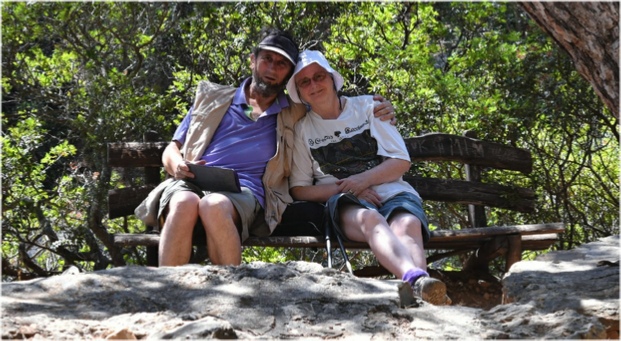 Ian and Caroline Lycett-King seated on a bench after climbing Pefki gorge on Crete